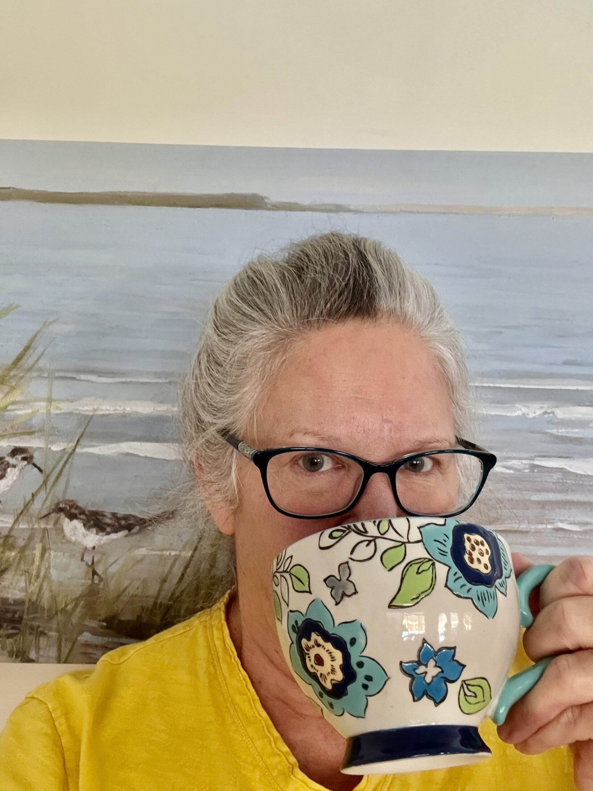 deb mccarren sipping from a coffee mug