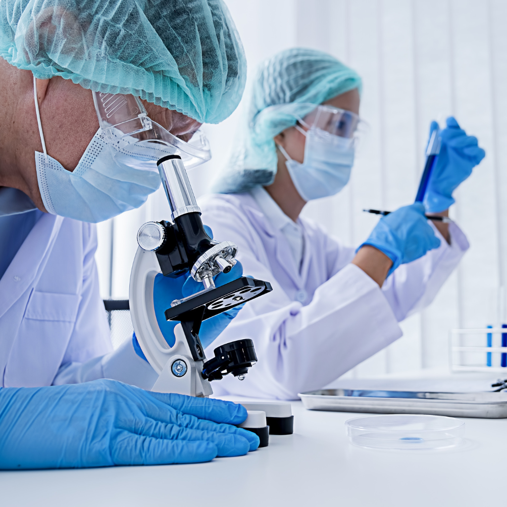 Innovation man and woman in sterile lab doing research
