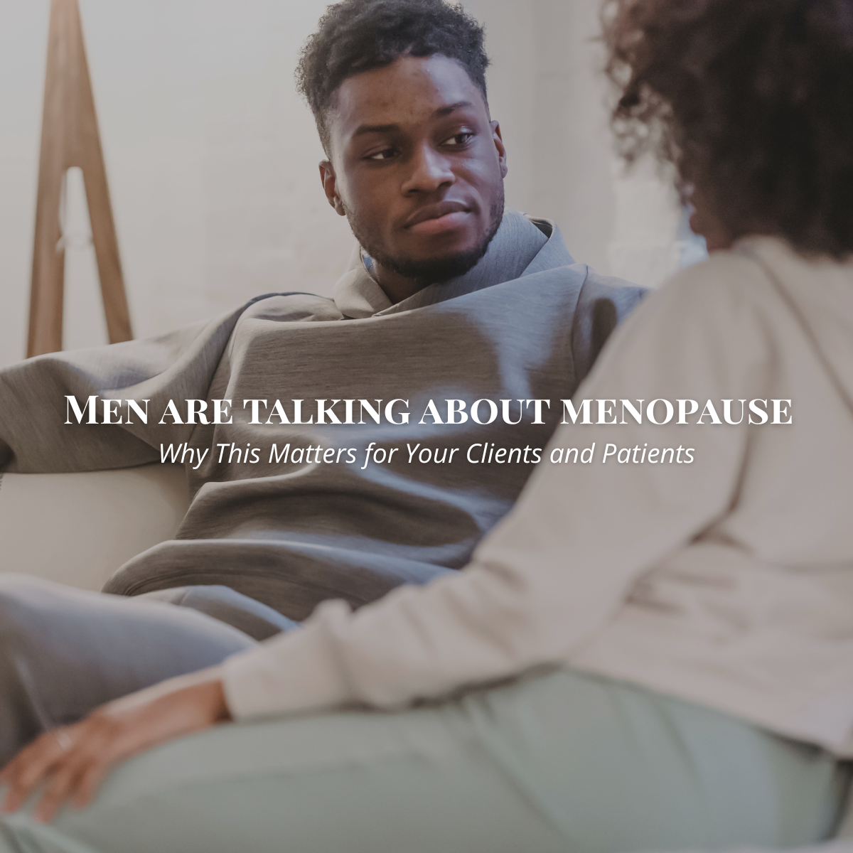 man and woman, seated, deep in conversation